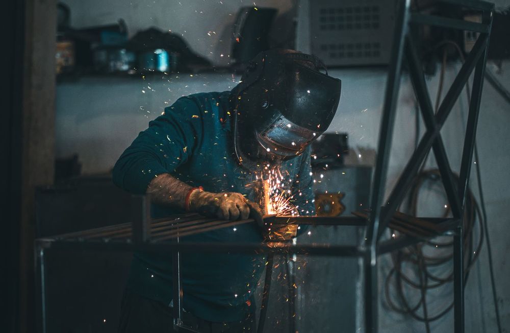 KP Glass & Aluminum team welding in the shop